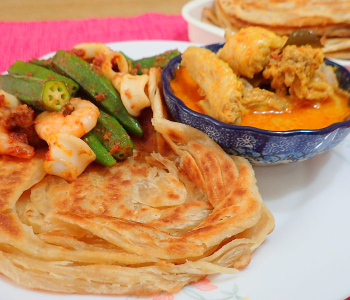 Roti Canai with chicken curry.