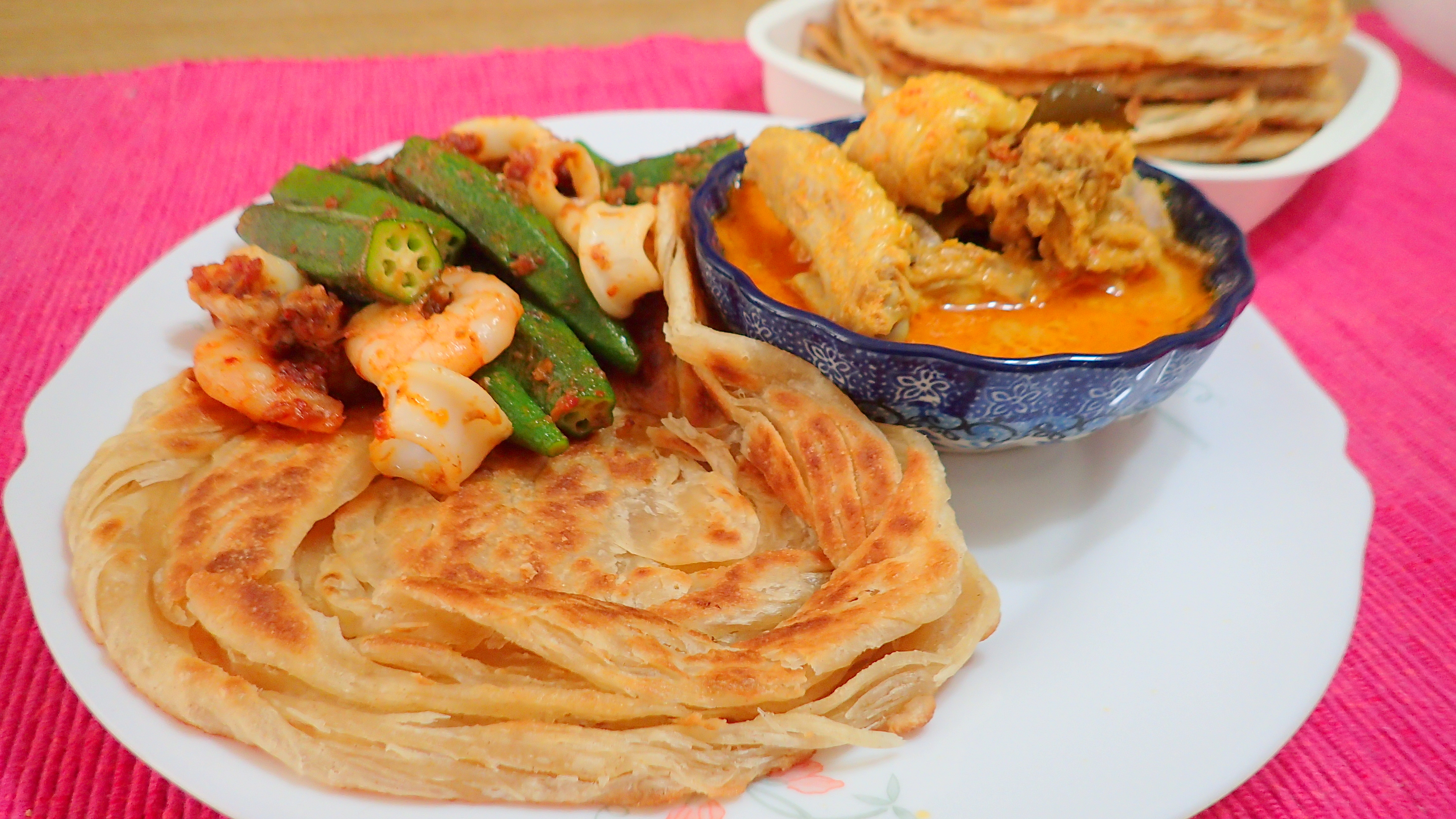 Roti Canai with chicken curry.