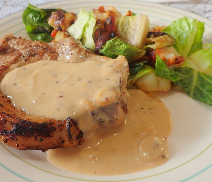 Pork Chops in a white wine creamy mustard sauce